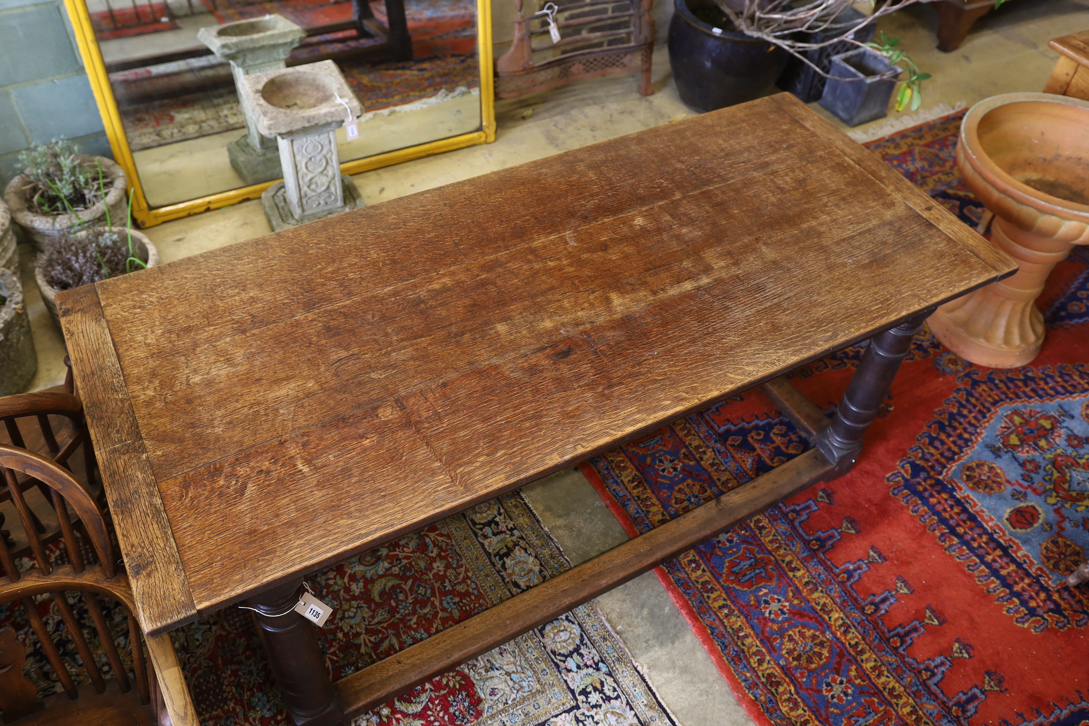An 18th century and later rectangular oak refectory dining table, width 183cm, depth 79cm, height 77cm